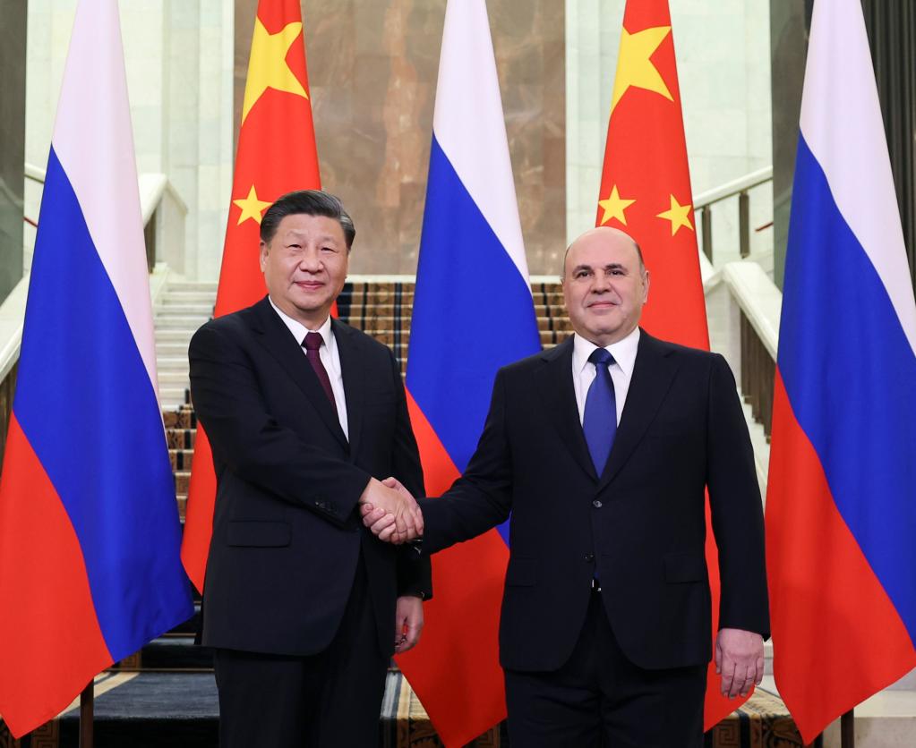當地時間3月21日上午,，國家主席習近平在俄羅斯聯(lián)邦政府大廈會見俄羅斯總理米舒斯京。新華社記者丁海濤攝